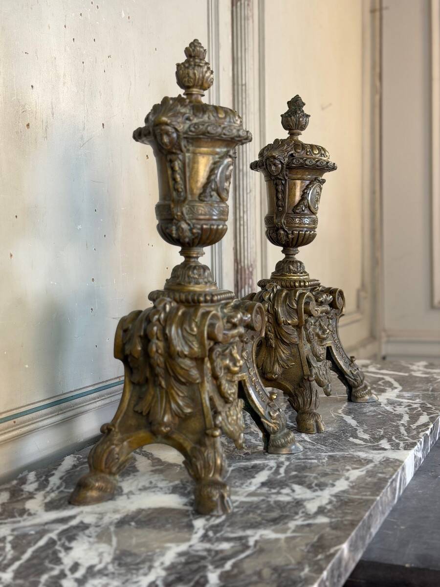 Pair of Louis XIV style andirons in bronze after a design by André-Charles Boulle.
