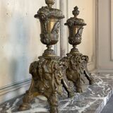 Pair of Louis XIV style andirons in bronze after a design by André-Charles Boulle.