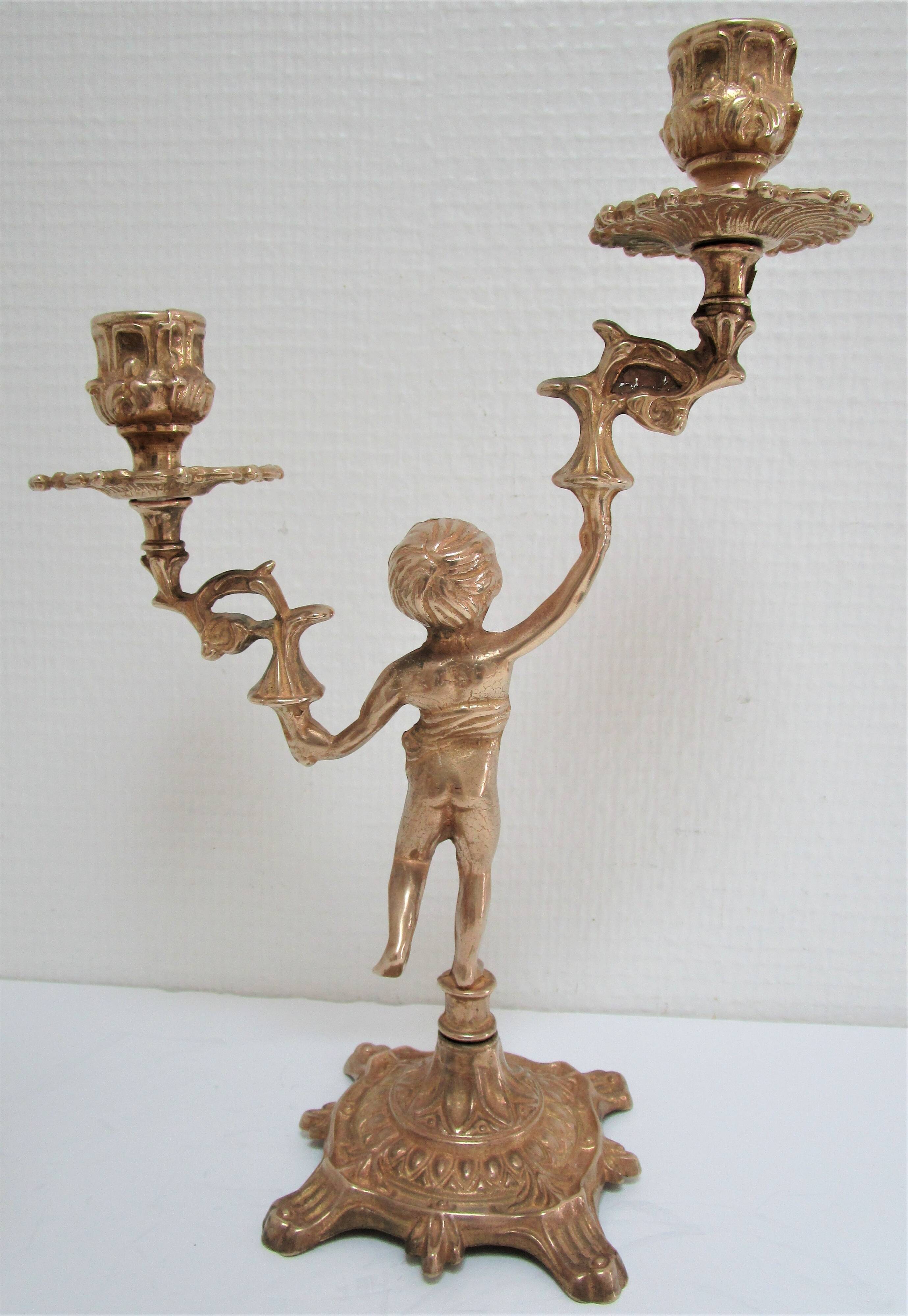 Pair of vintage golden brass cherub candlesticks