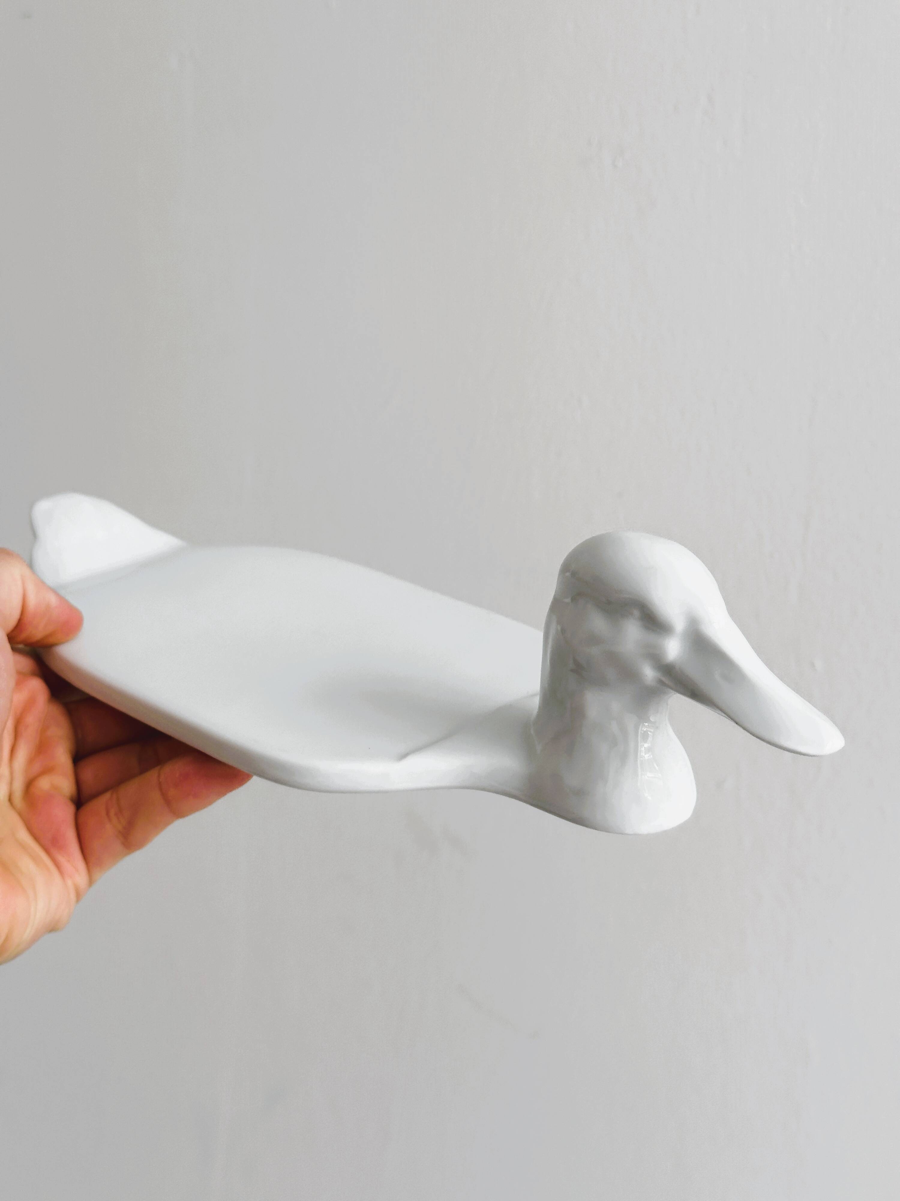 White porcelain dish in the shape of a duck.