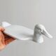 White porcelain dish in the shape of a duck.