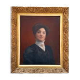 Old painting, portrait of a woman from the early 20th century.