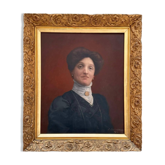 Old painting, portrait of a woman from the early 20th century.