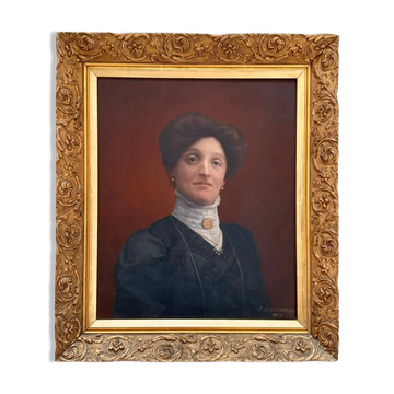 Old painting, portrait of a woman from the early 20th century.