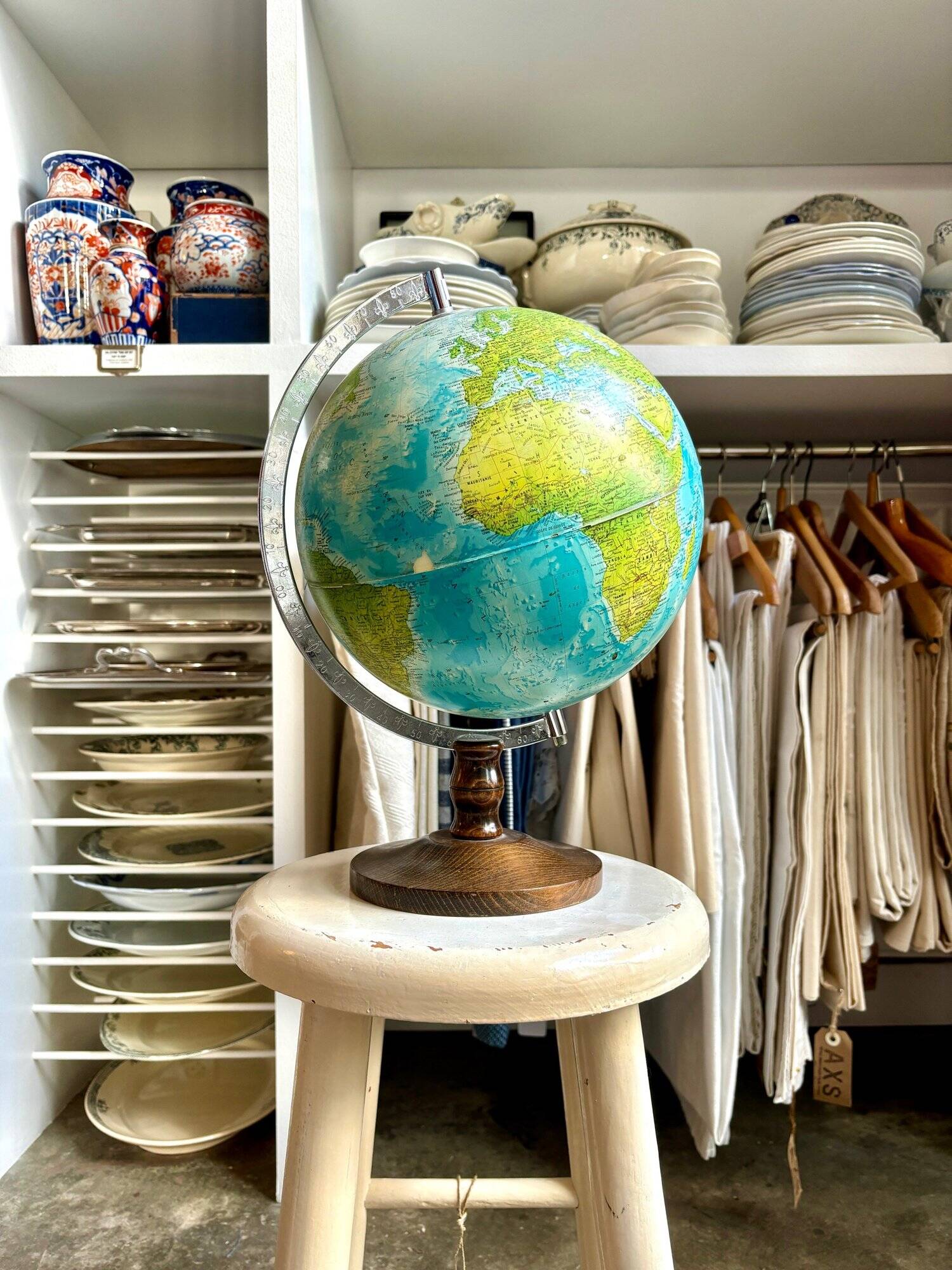 World map, globe with wooden base
