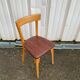 Chaise Baumann assise skaï