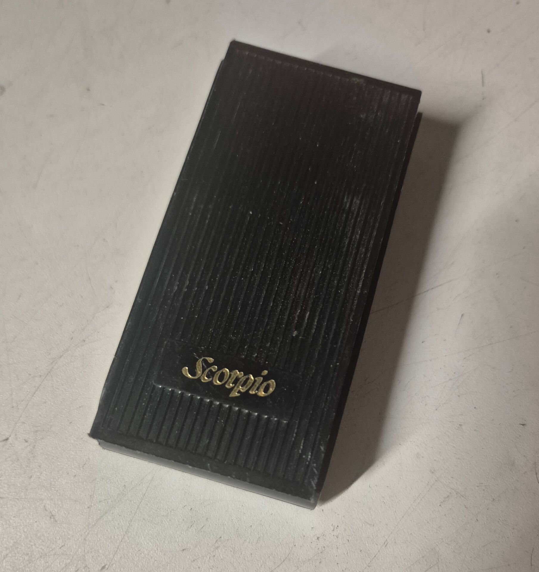 Vintage Scorpio gas lighter in its collector's case.