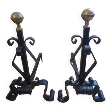 Pair of wrought iron andirons and brass ball.