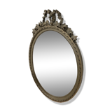 Vintage wooden mirror with arch and flowers