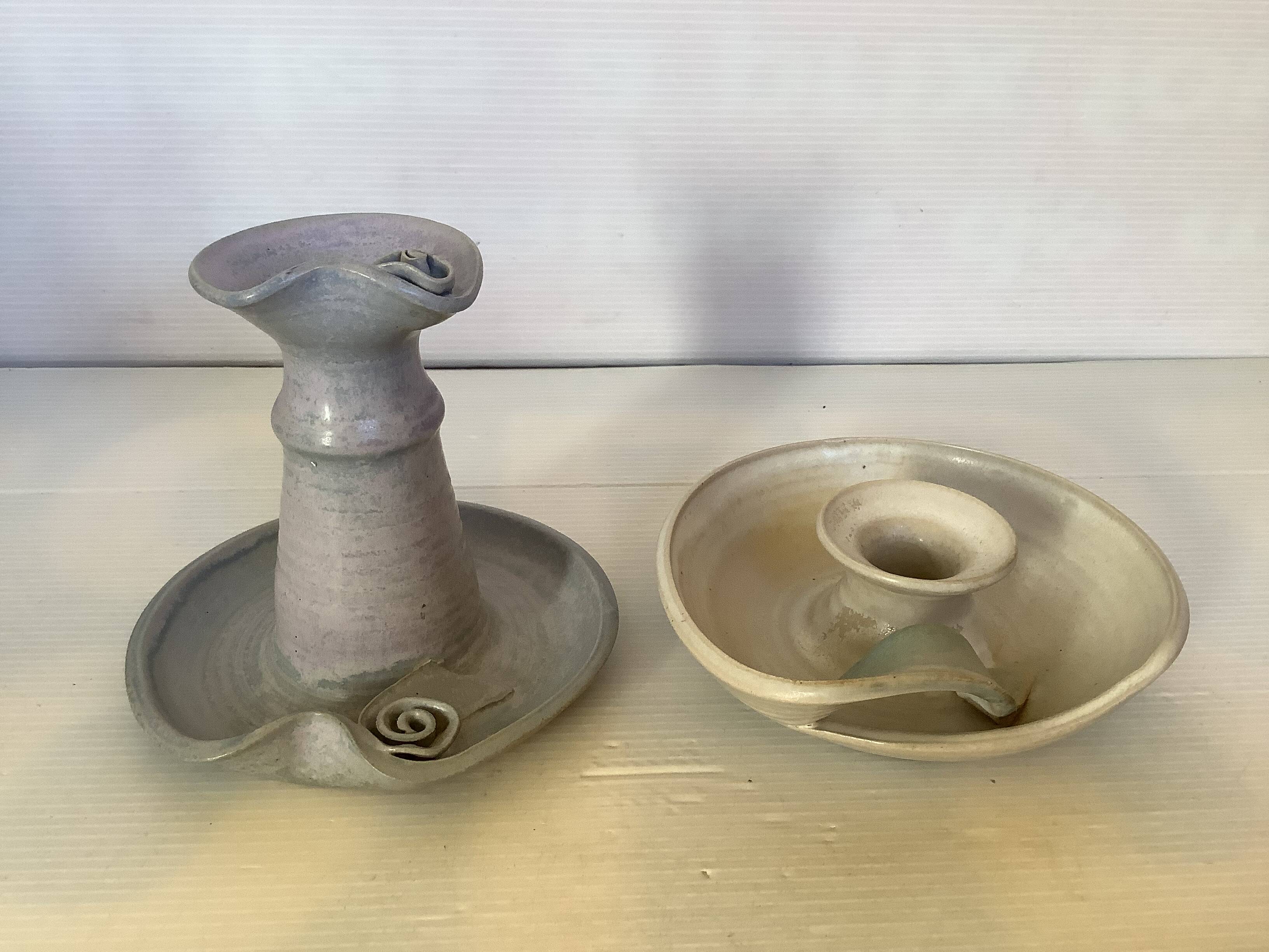 Pair of signed ceramic candlesticks