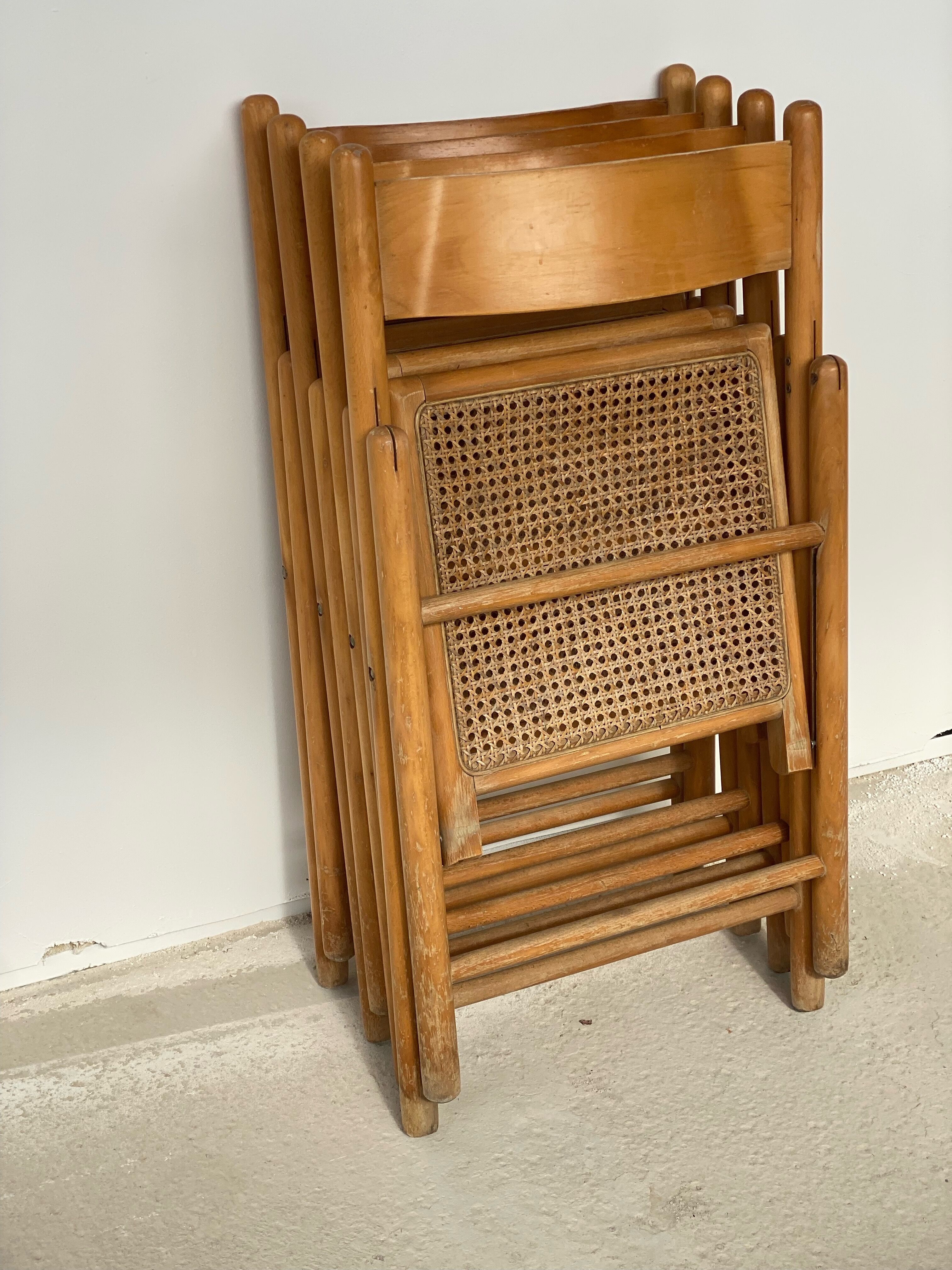 Set of 4 folding chairs, vintage design, wooden structure and canned seat. Around 1970