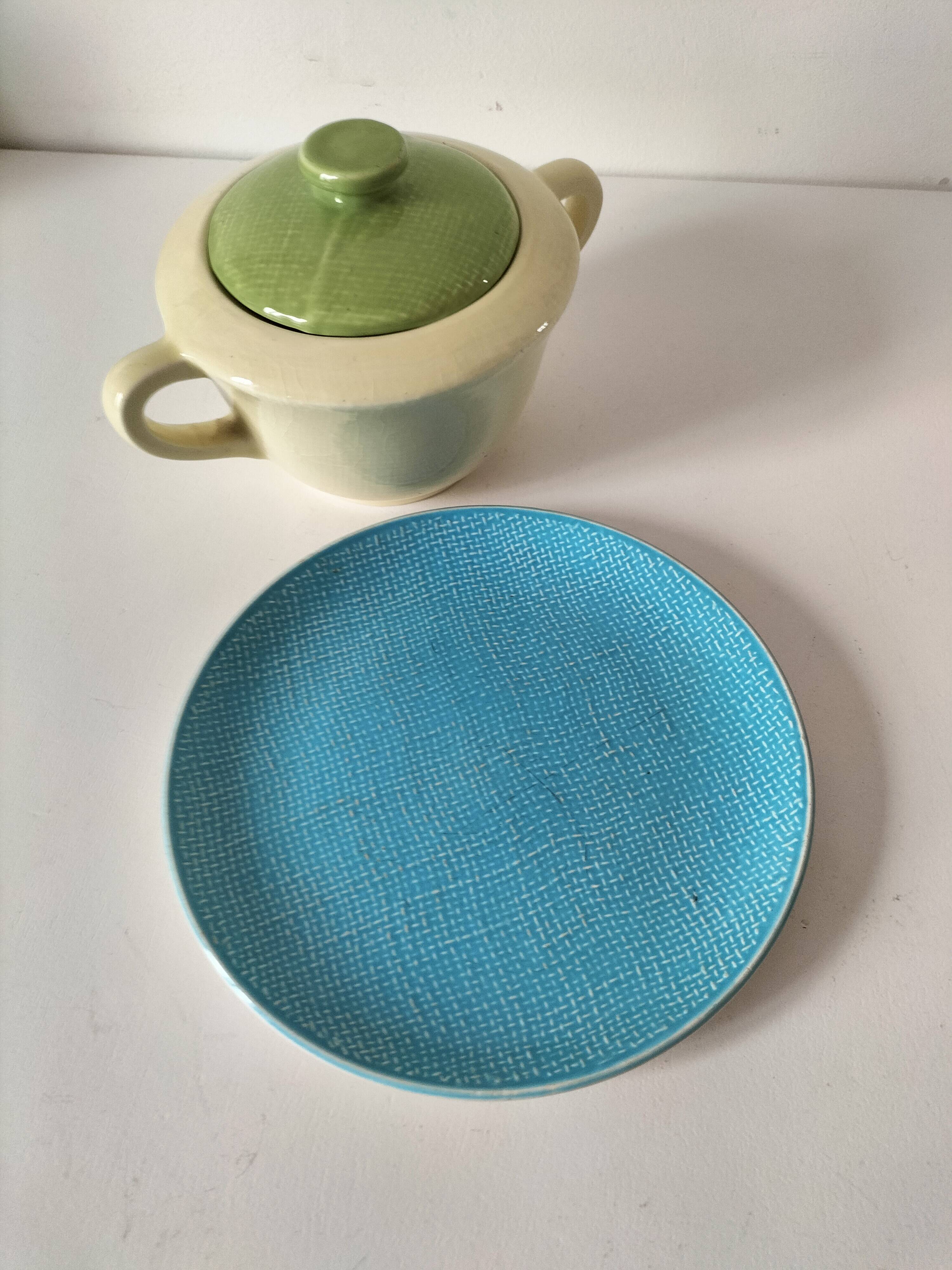 Two sugar bowls and a textured plate in turquoise and green Salins earthenware.