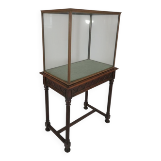 Antique display cabinet in 19th-century Gothic Revival style.