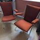 Pair of vintage folding chairs in terracotta fabric.