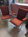 Pair of vintage folding chairs in terracotta fabric.
