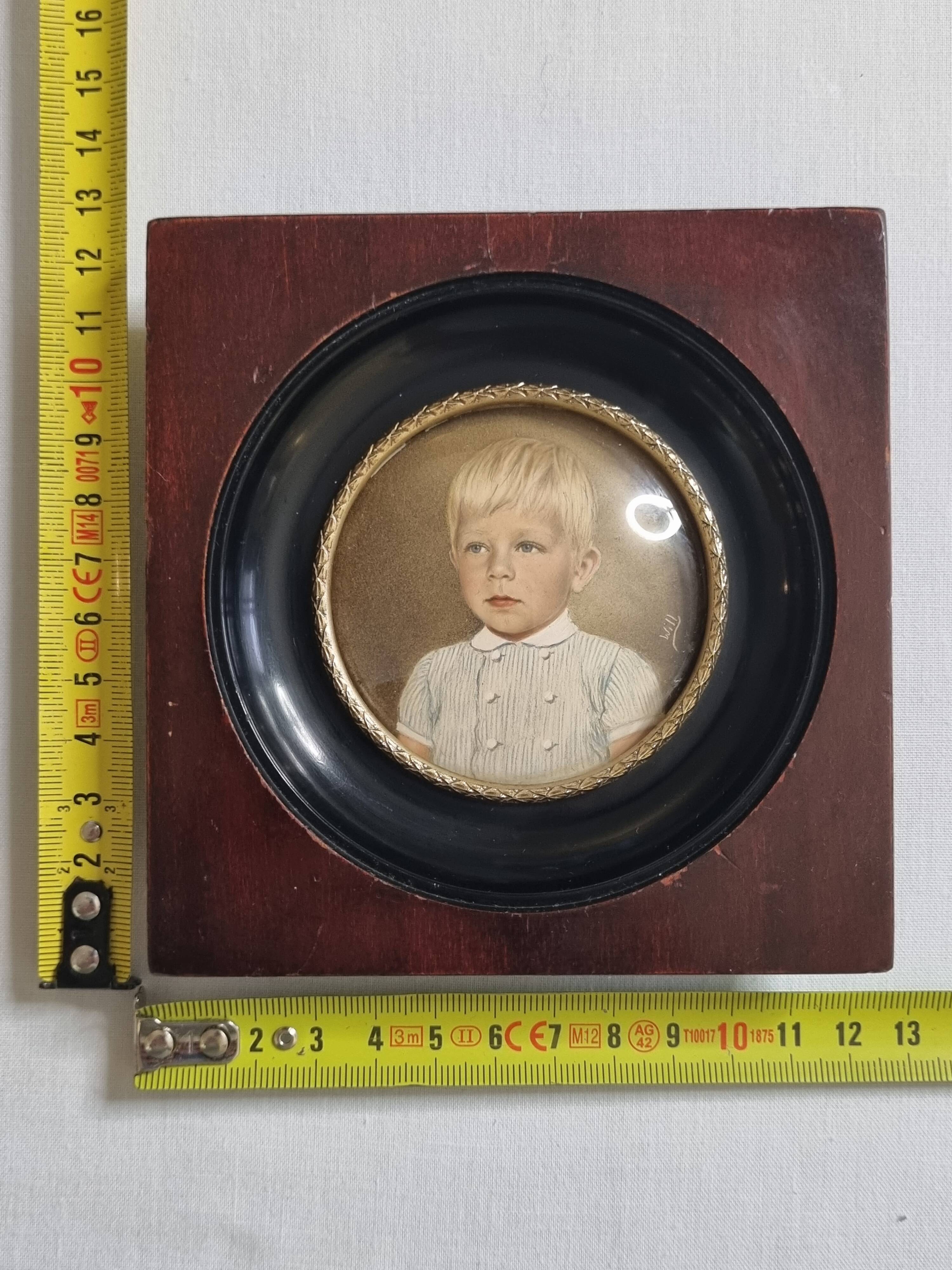 Miniature portrait of a young boy signed, wooden frame with convex glass, 12x12 cm.
