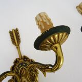 Pair of double-light Empire style arrow wall lights in bronze. Early 20th century