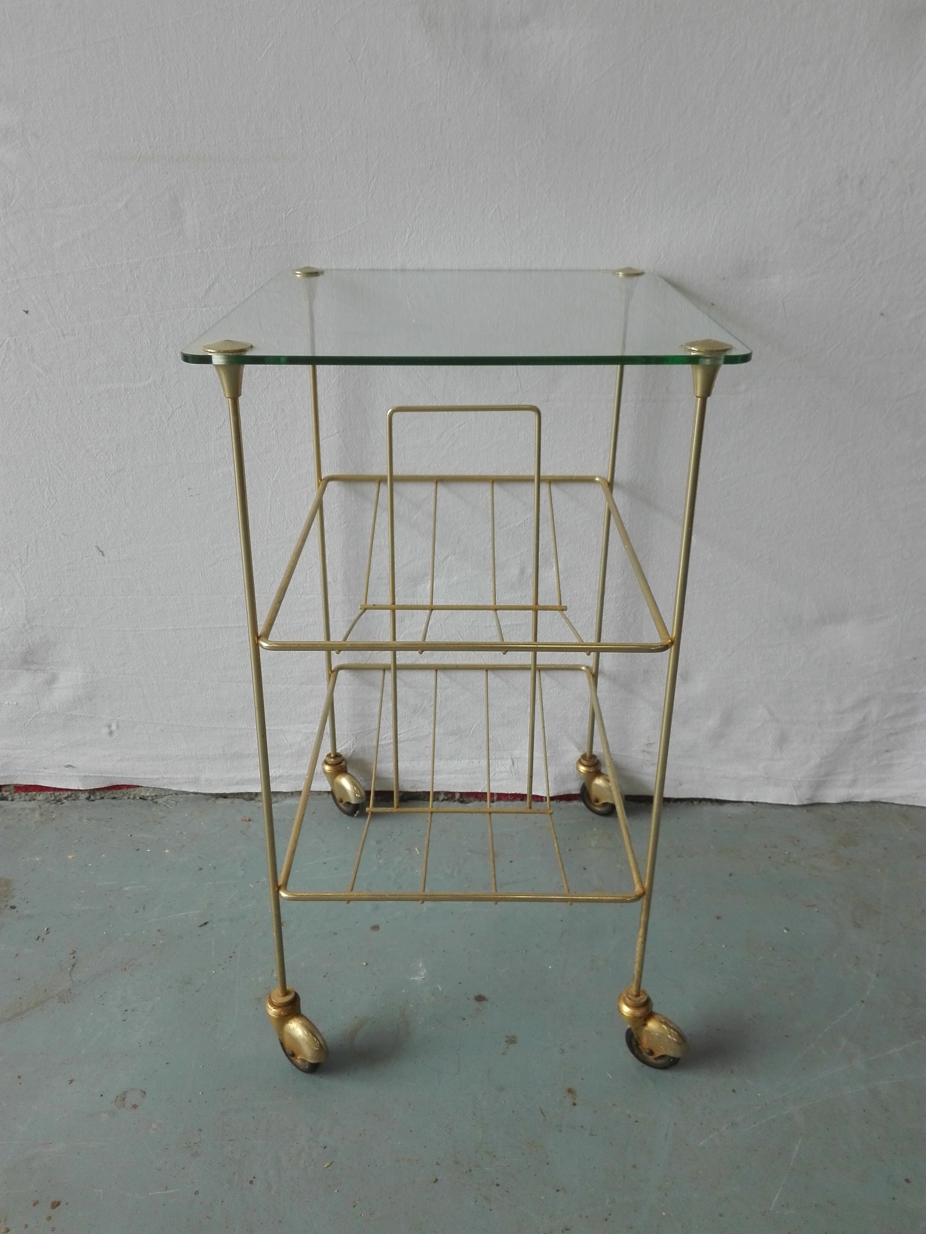 Brass and glass magazine door