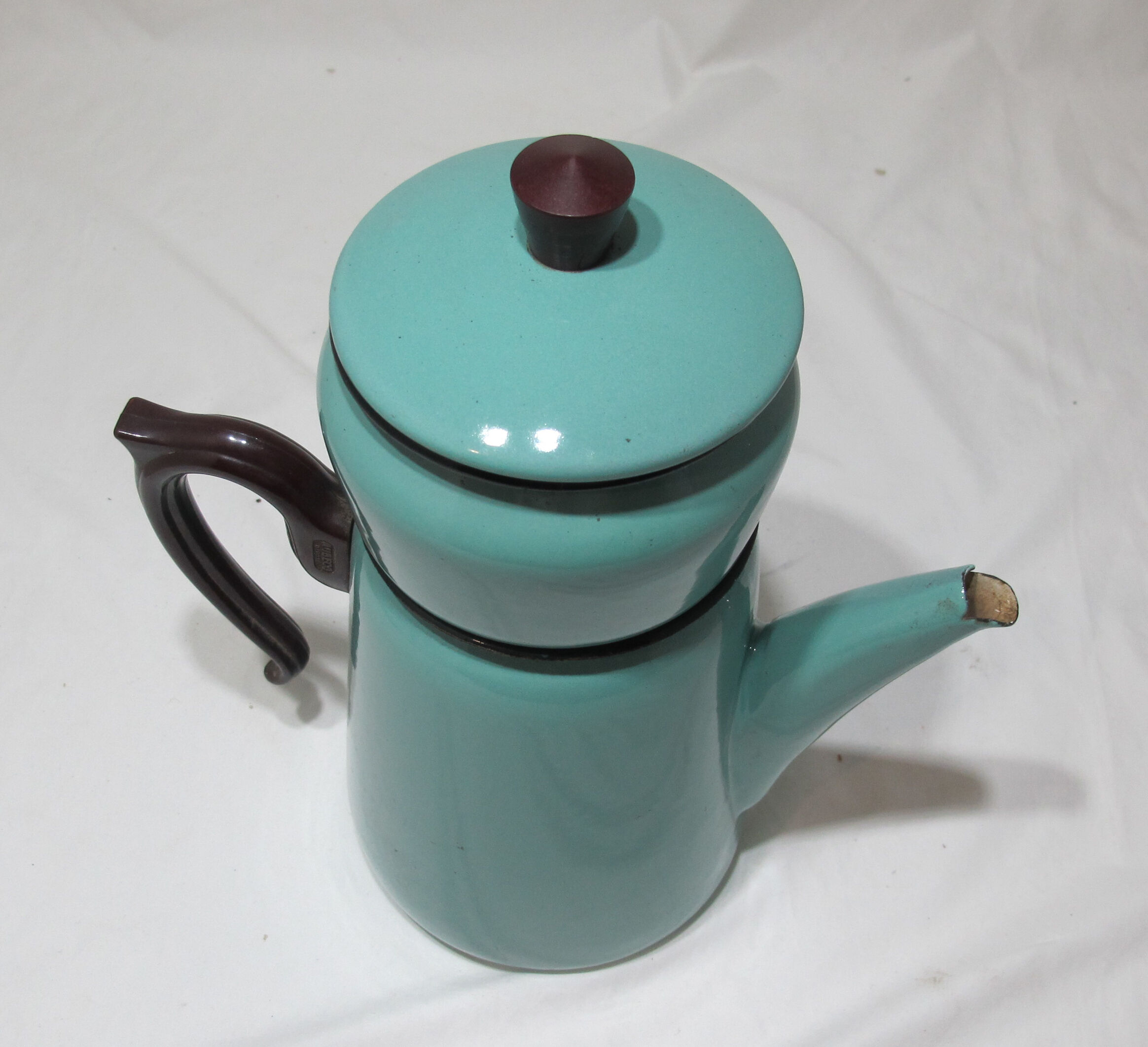large vintage coffee maker made of enamelled sheet metal
