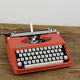 Hermès Baby orange typewriter.