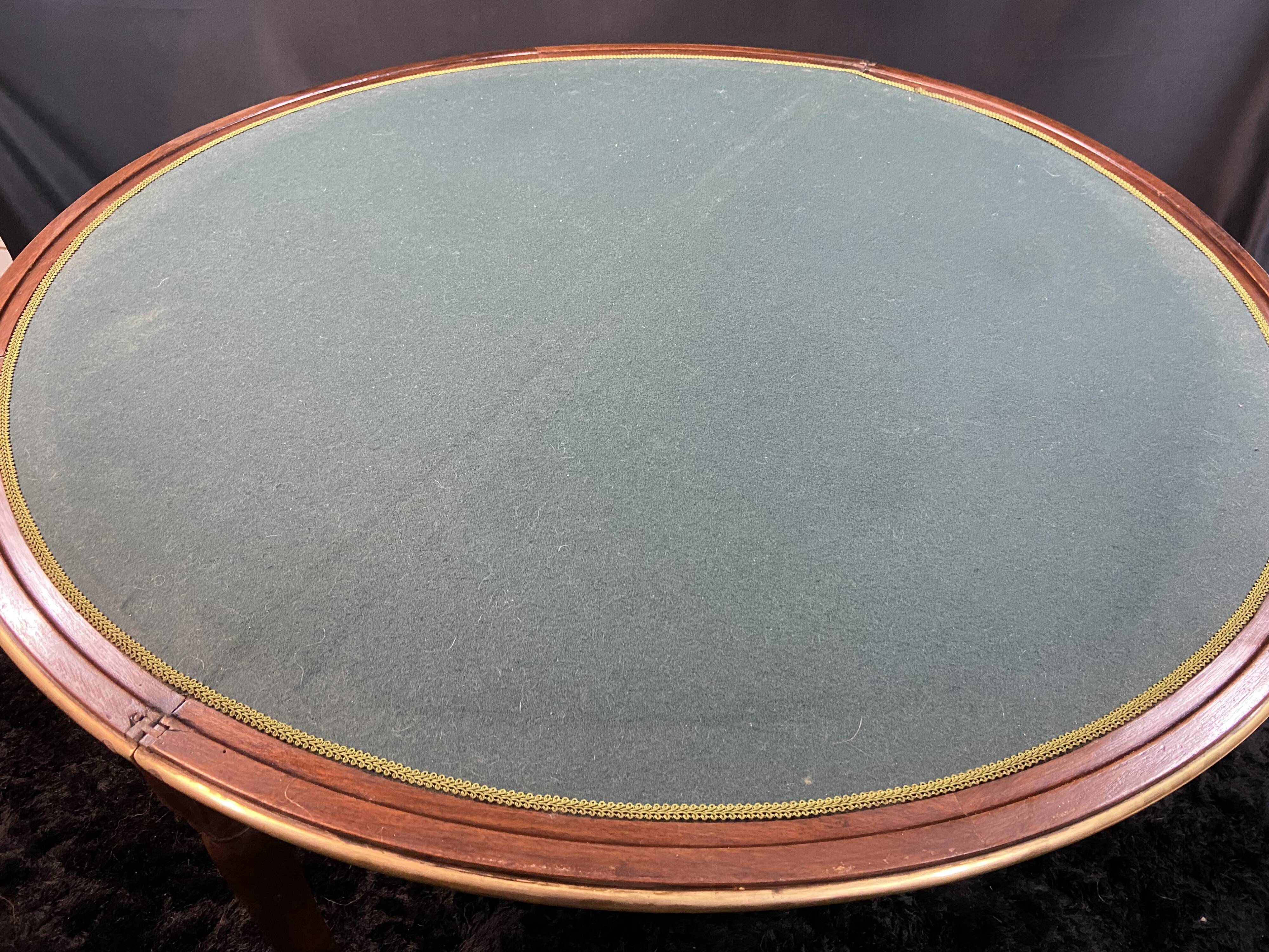 A Louis XVI period mahogany half-moon table forming a console/games table