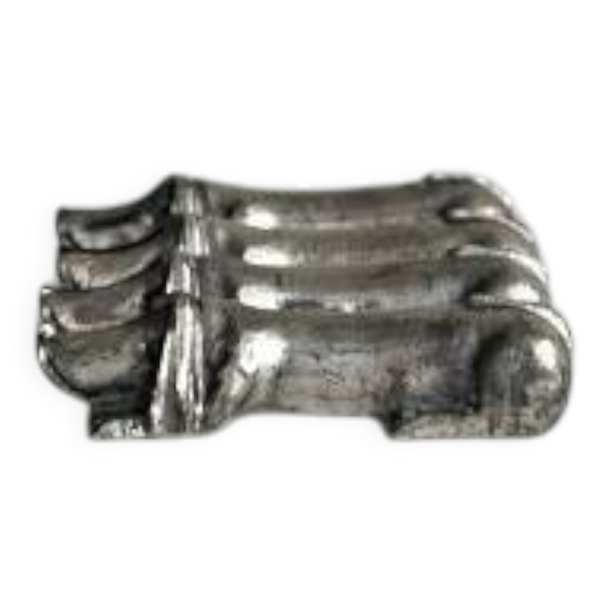 Antique metal knife rest in the shape of a dog.