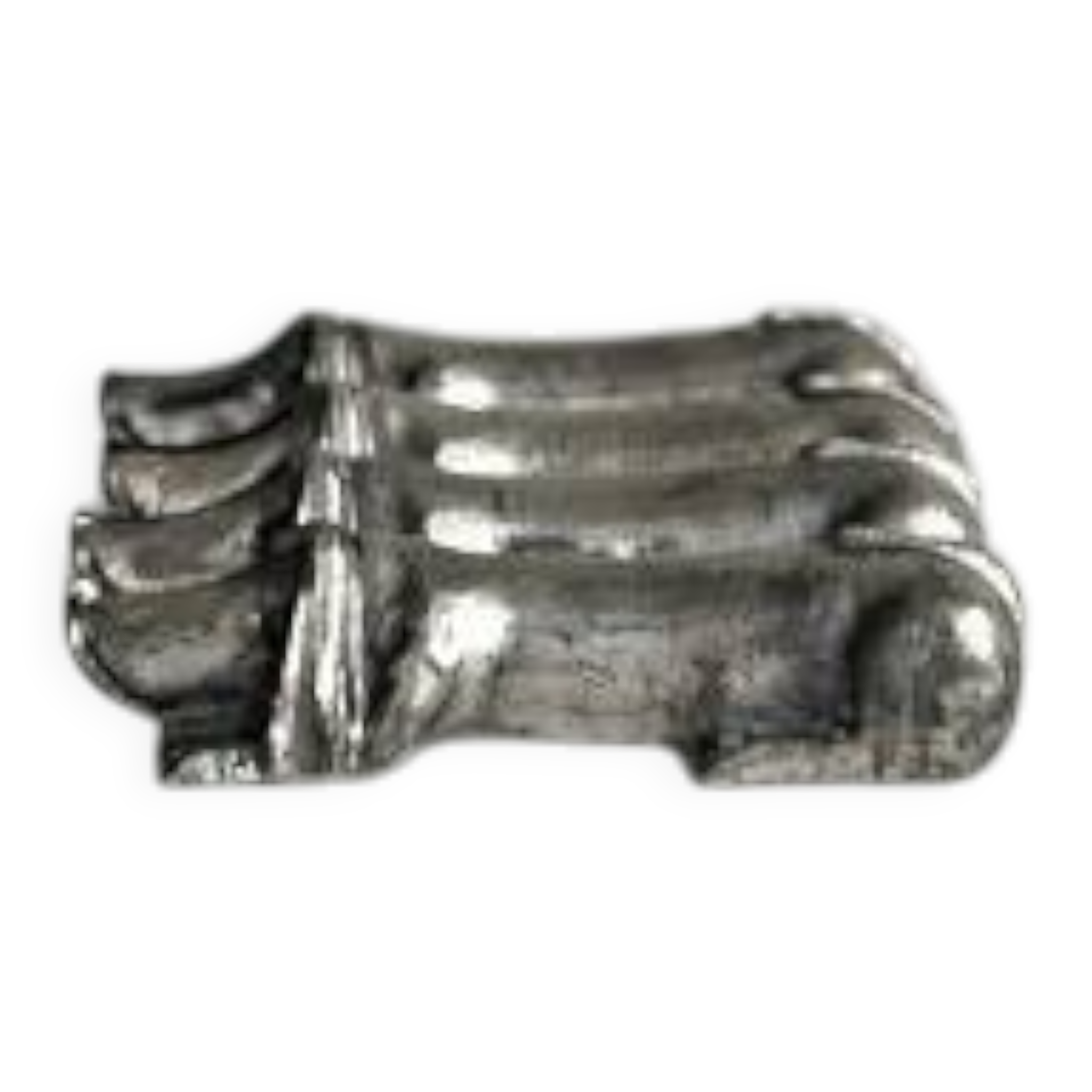 Antique metal knife rest in the shape of a dog.