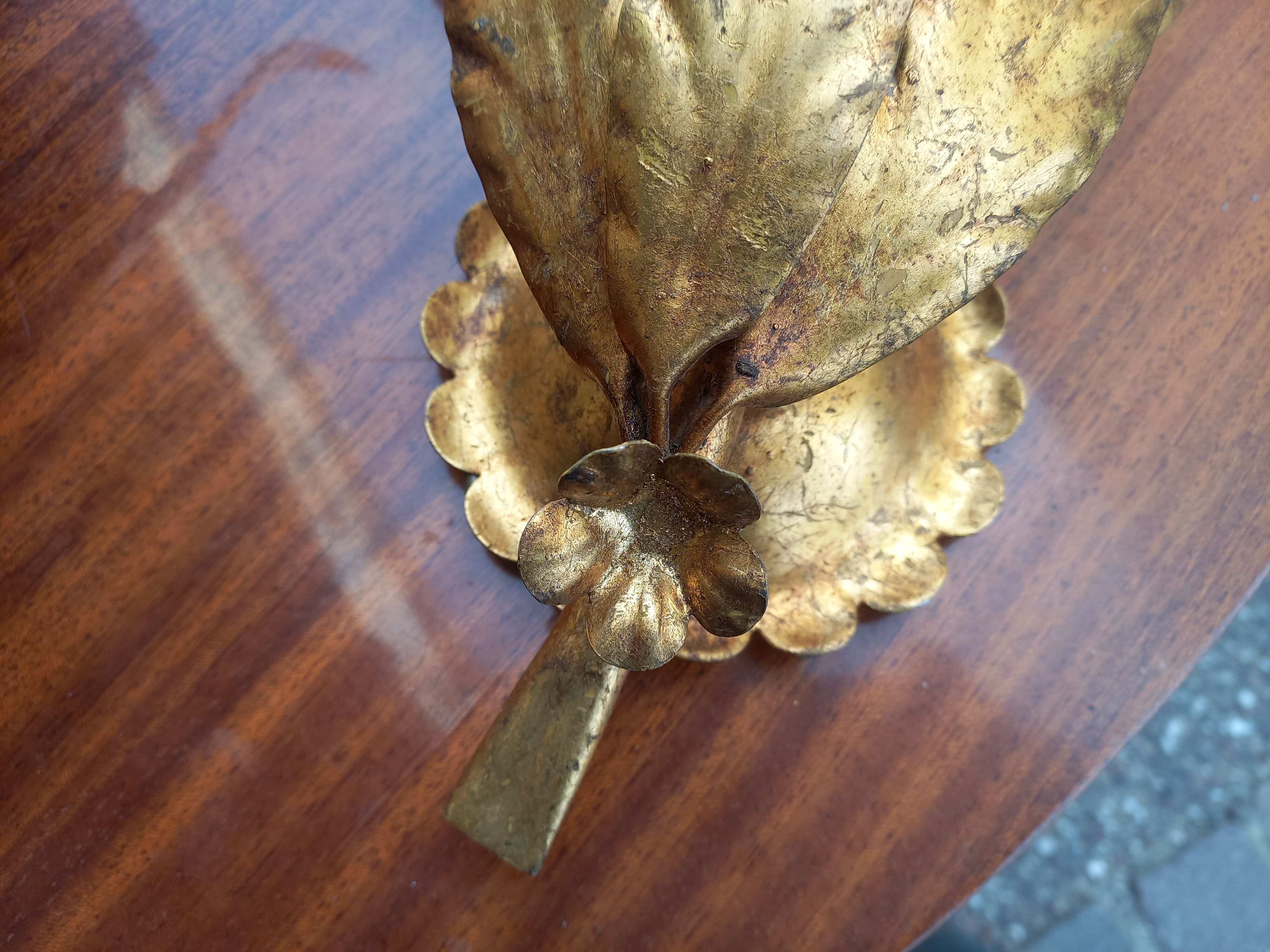 Pair of gold leaf sconces