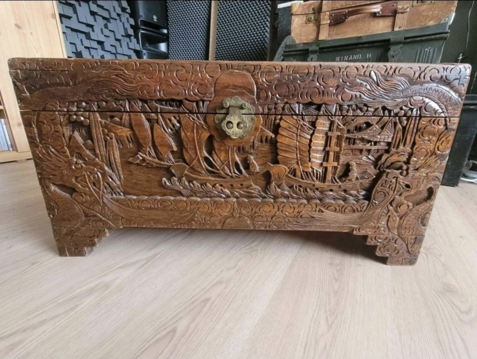 Carved chest in Asian camphor wood, chinoiserie boat decoration.