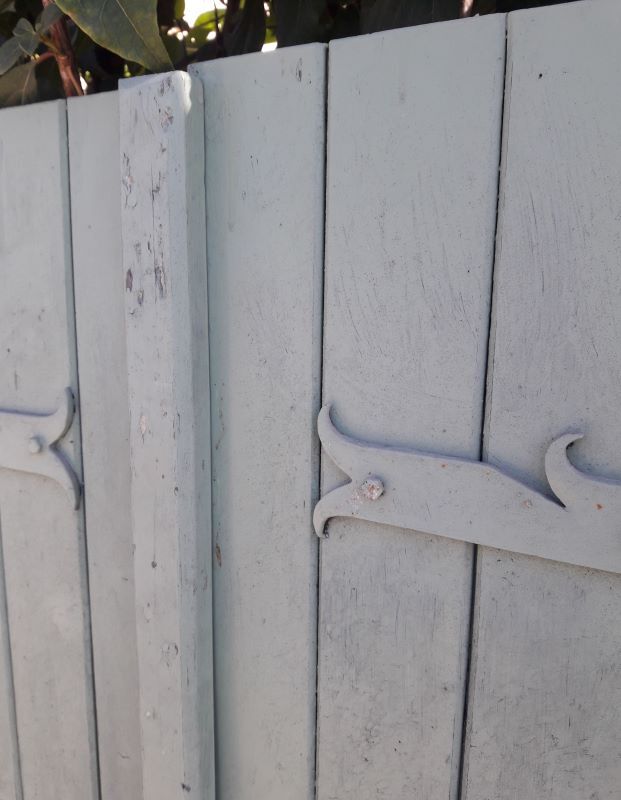 Pair of wooden shutters hanging iron