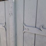 Pair of wooden shutters hanging iron