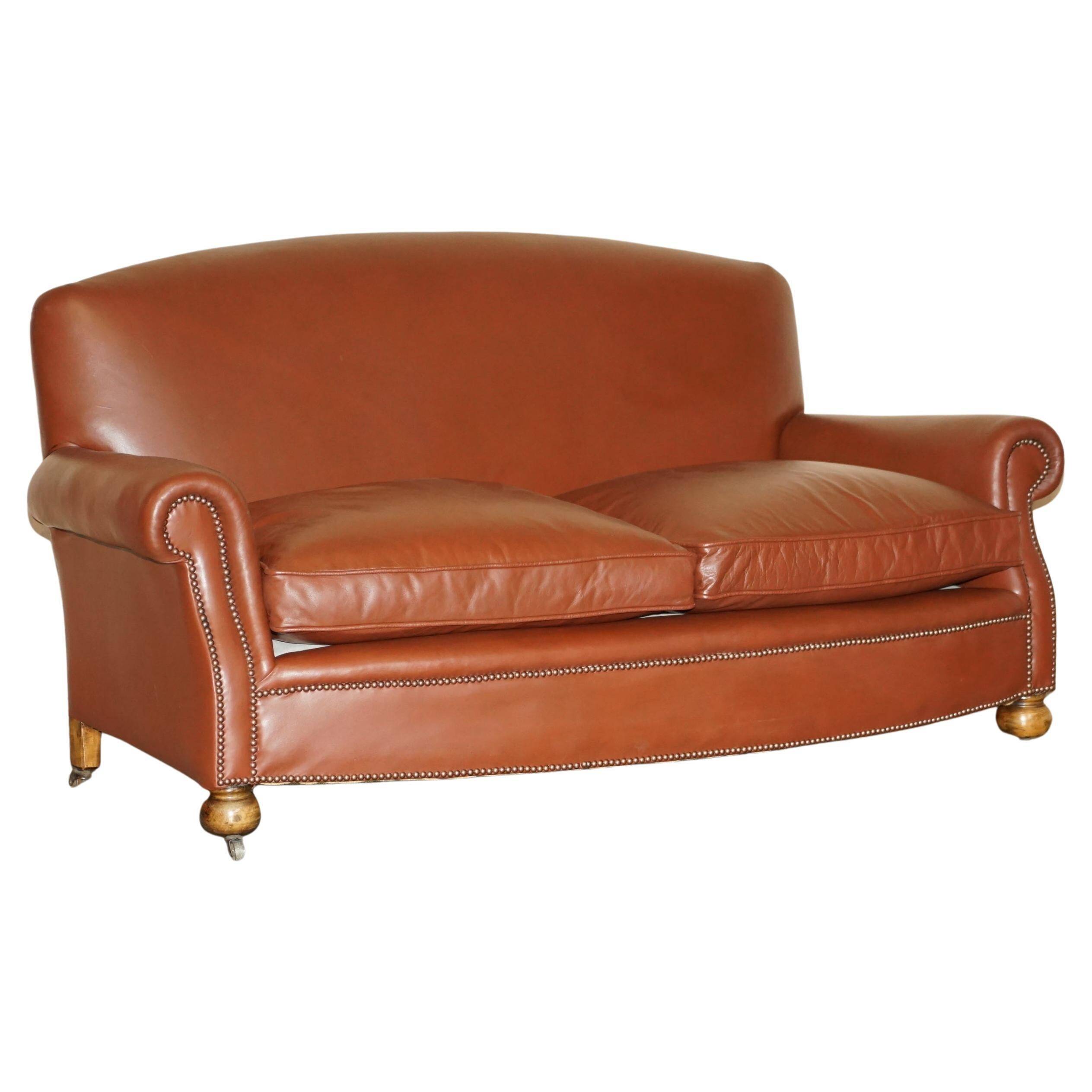 Edwardian leather club canapé circa 1910 with feather cushions.