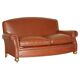 Edwardian leather club canapé circa 1910 with feather cushions.