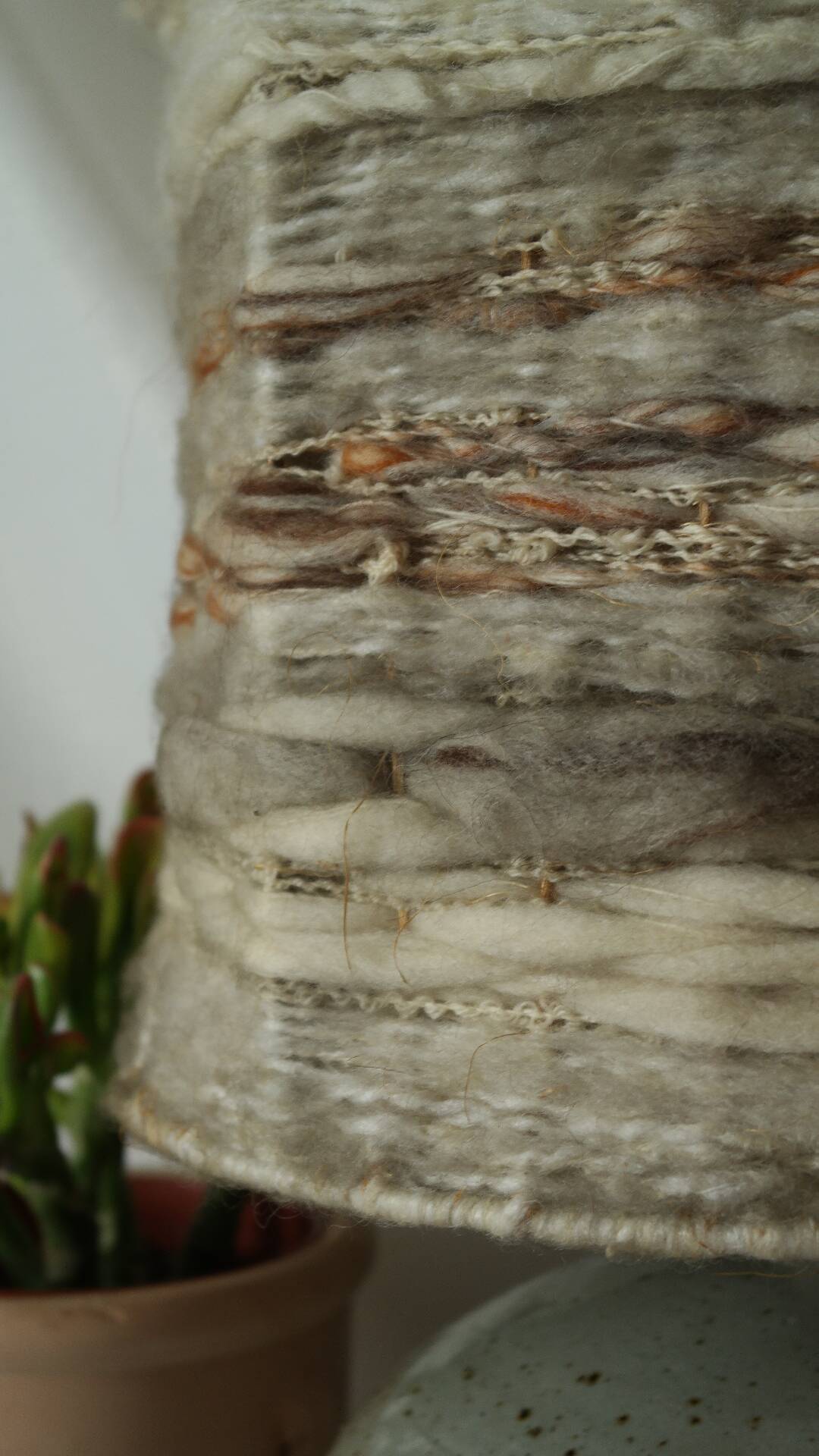 Vintage ceramic lamp with a wool shade.