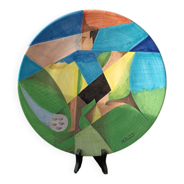 Osvaldo Perruzzi designer of polychrome faience plates.