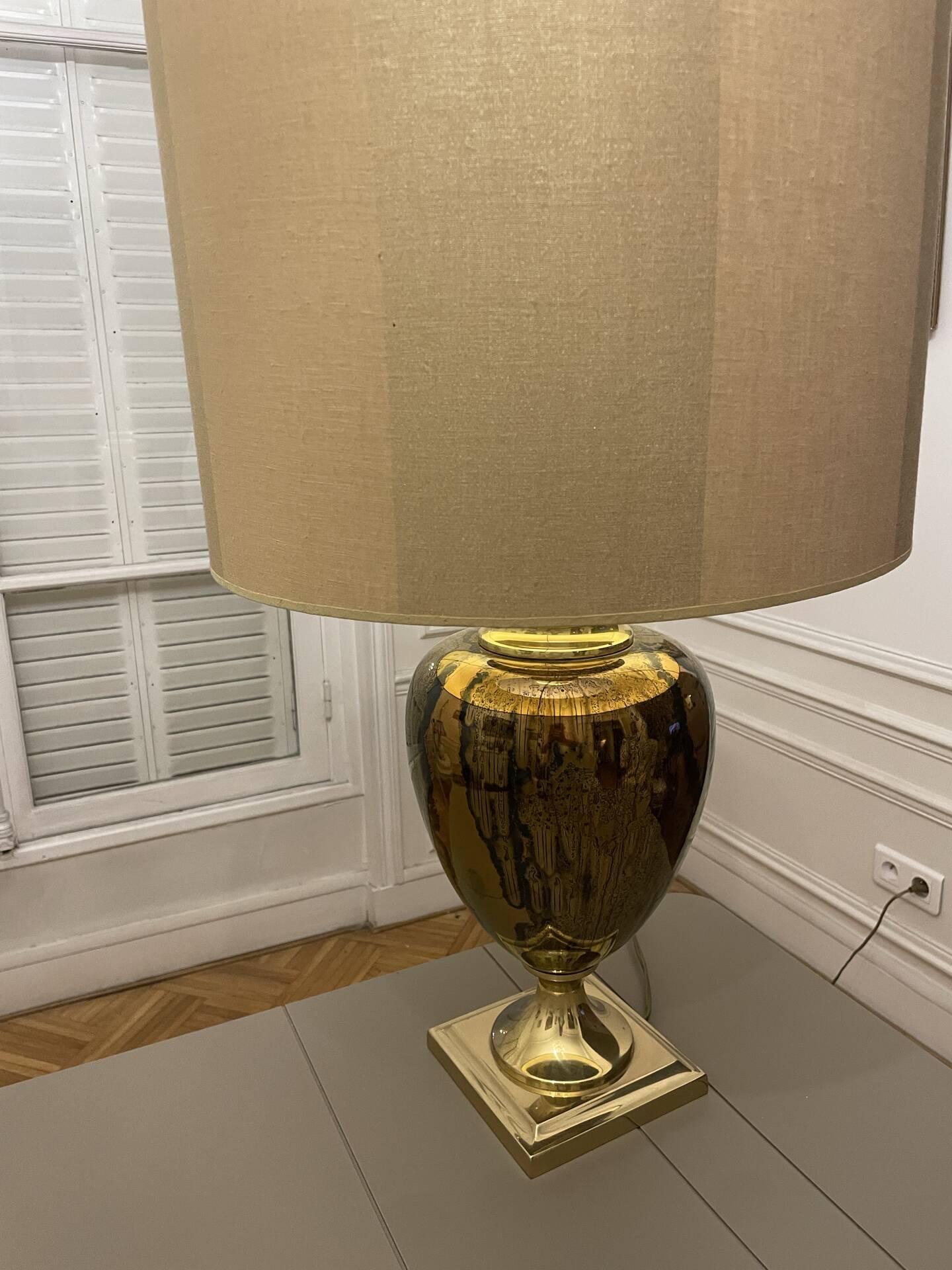 Bronze table lamp with a golden shade.