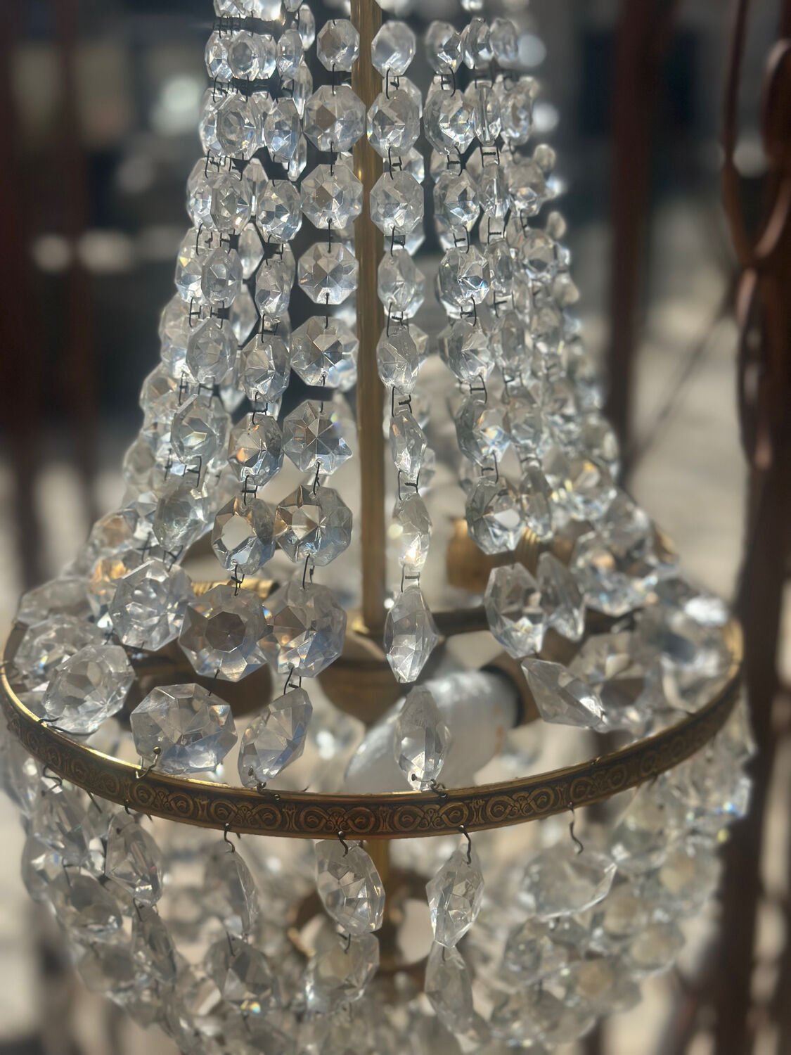 Basket chandelier with crystal and gilded brass pendants, circa 1930.