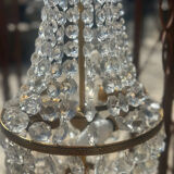 Basket chandelier with crystal and gilded brass pendants, circa 1930.