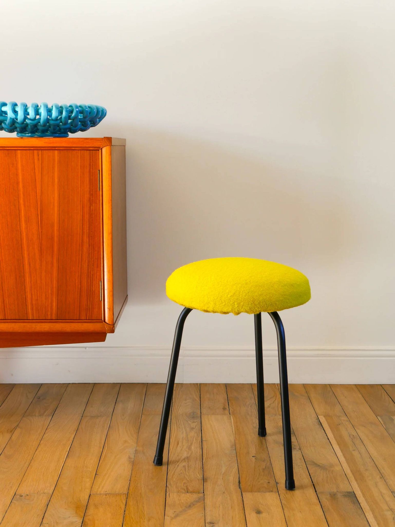 Black iron tripod stool with boiled wool, yellow, 1960.