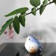 Vintage bird salt cellar in blue and white porcelain.