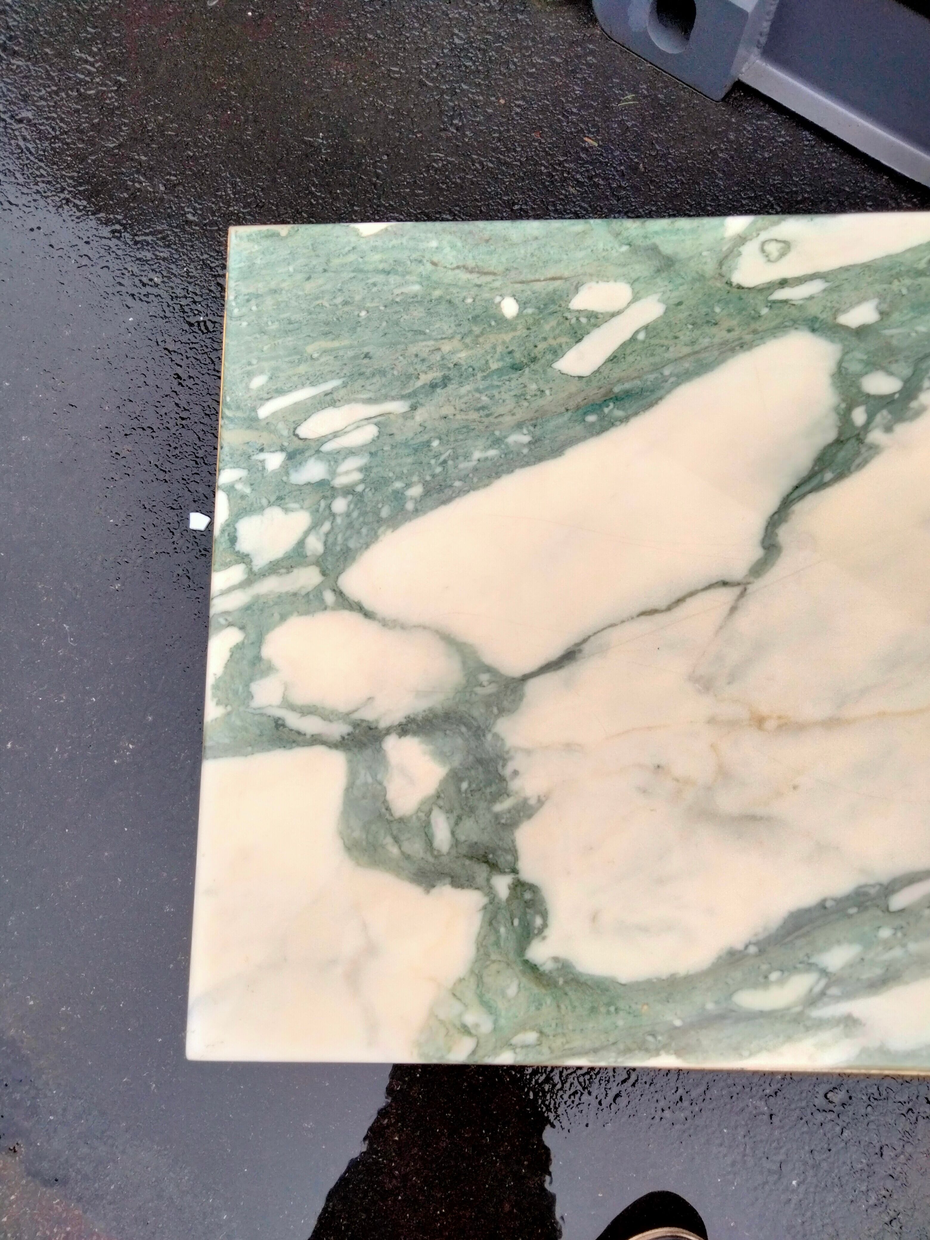 Old vintage gilded side table with marble top