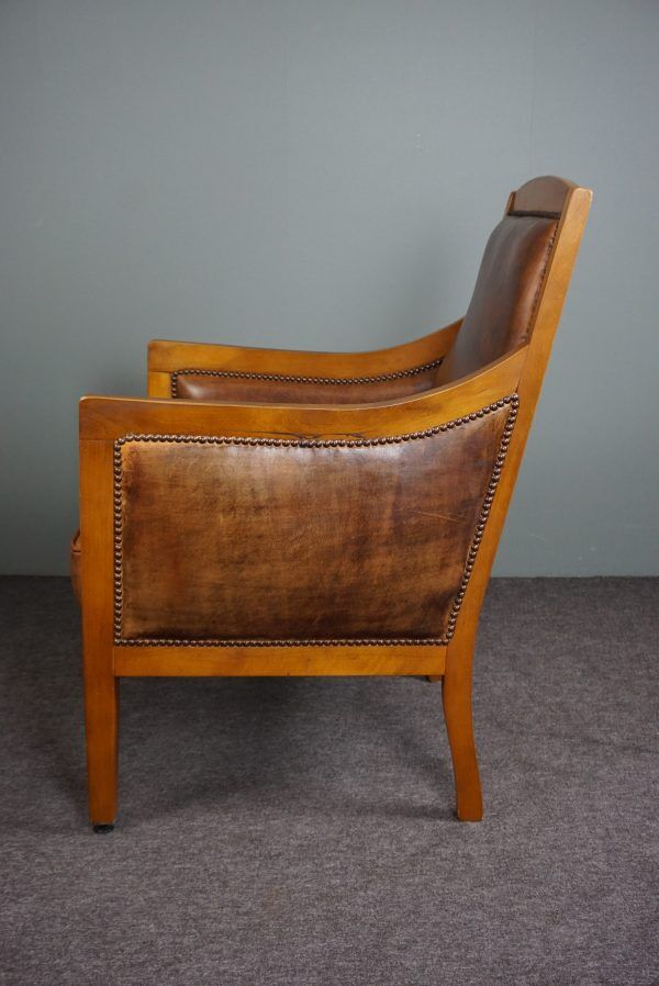 Armchair in sheepskin with beautiful light wood