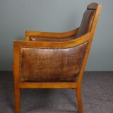 Armchair in sheepskin with beautiful light wood