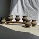 Small brutalist handcrafted terracotta vase with a pedestal, Indonesian, H19 D17.
