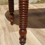 Antique walnut table with drop-leaf doors