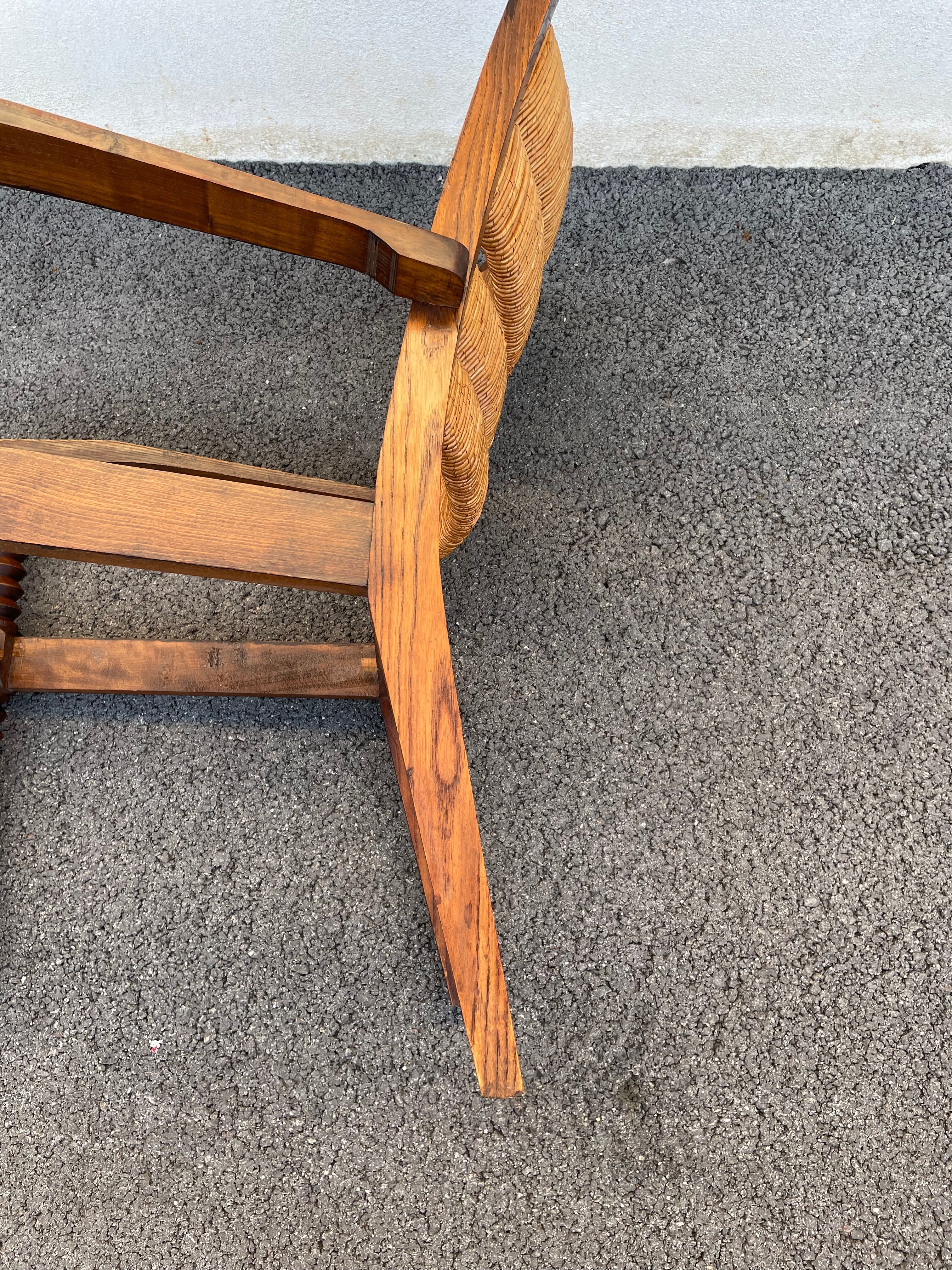 Vintage armchair in straw and brutalist wood