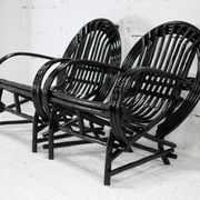 Pair of black lacquered rattan armchairs. France, cira 1960.