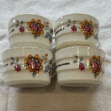 Set of 4 fine porcelain coffee cups with floral patterns and silver accents.
