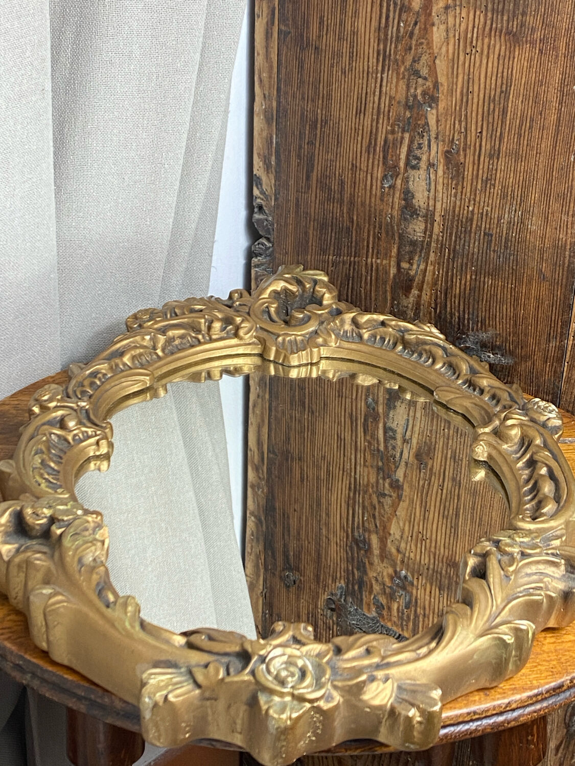 Rococo style mirror in wood and gilded stucco