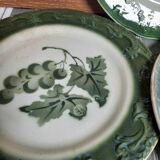 Antique earthenware plates with fruit decoration.